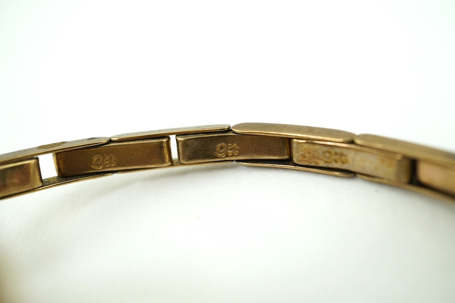 A lady's 9ct gold manual wind wrist watch, on a 9ct flexible bracelet, gross weight 17 grams and a lady's Rotary steel and gold plated wrist watch. Condition - poor to fair